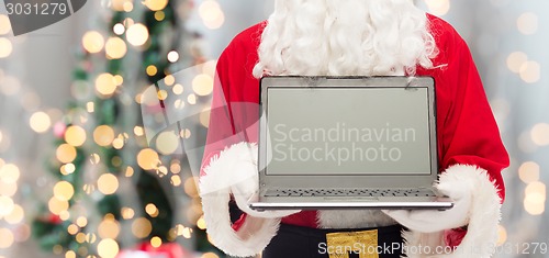 Image of close up of santa claus with laptop