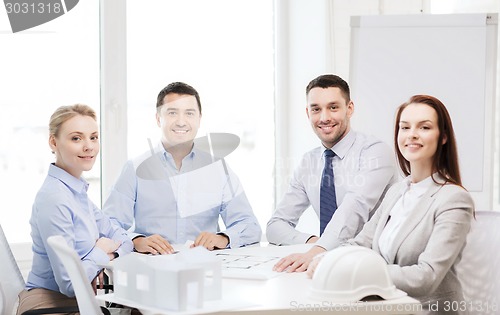 Image of happy team of architects and designers in office