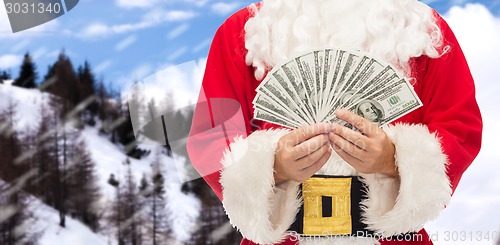 Image of close up of santa claus with dollar money