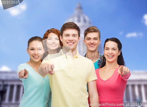 Image of group of smiling teenagers showing ok sign