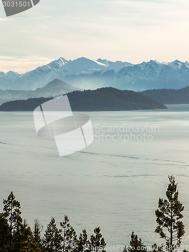 Image of Lake And Misty Snowy Mountain