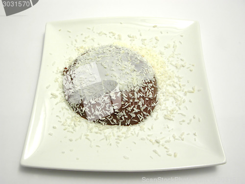 Image of Chocolate pudding with yoghurt and grated coconuts