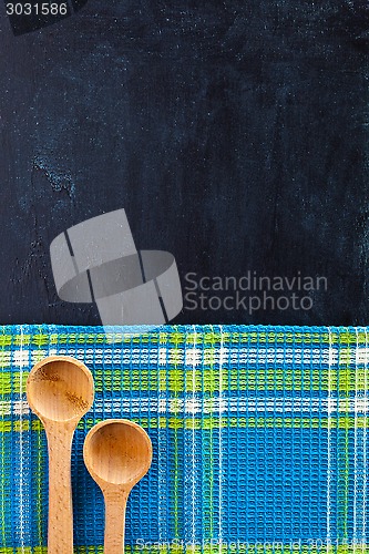 Image of wooden spoons and tablecloth 