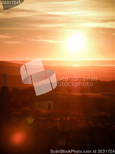 Image of Coastal Sunset Over Shack