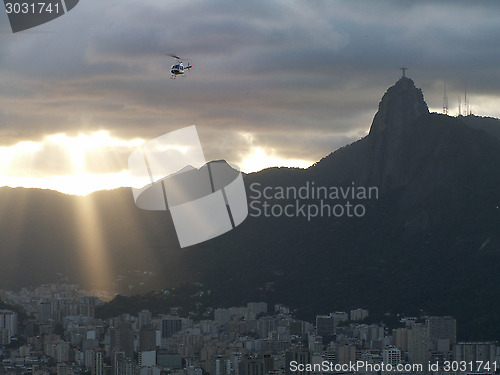 Image of Christ Redeemer And Rio Sunset With Helicopter