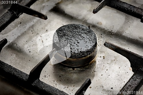 Image of Dirty gas burner closeup