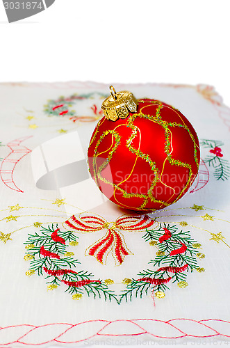 Image of Red Christmas ball embroidered napkin isolated