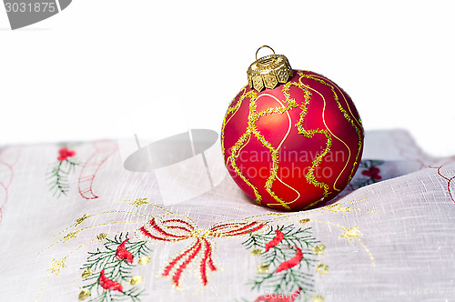 Image of Red Christmas ball embroidered napkin isolated