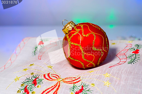 Image of Red Christmas ball on a napkin