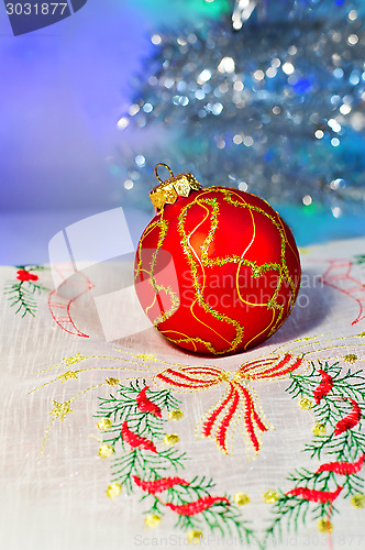Image of Red Christmas ball on a napkin