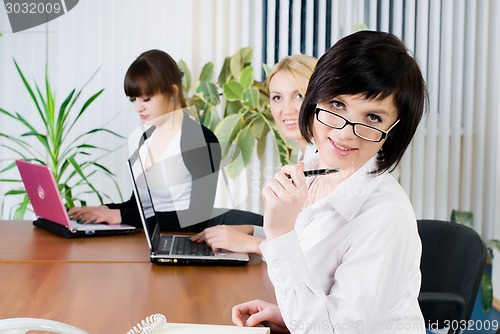 Image of Attractive business ladies in office