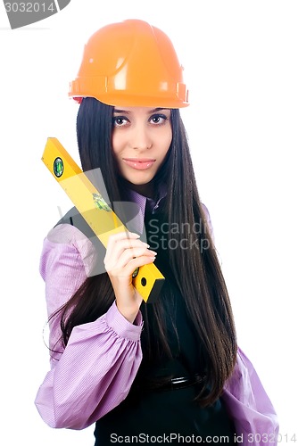 Image of Attractive girl in helmet with level