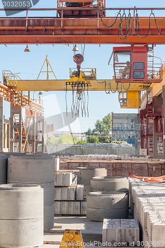 Image of Operator of crane works at finished good warehouse