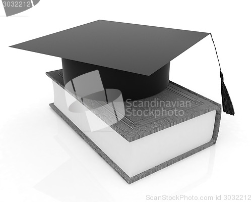 Image of Graduation hat on a leather book