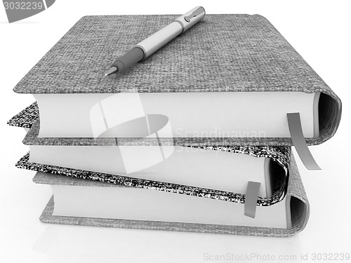 Image of pen on notepads stack