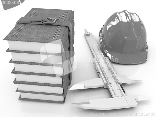 Image of Vernier caliper, leather books and yellow hard hat 