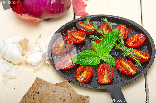 Image of baked cherry tomatoes with basil and thyme