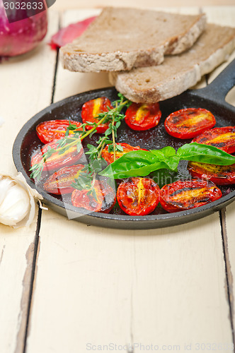 Image of baked cherry tomatoes with basil and thyme