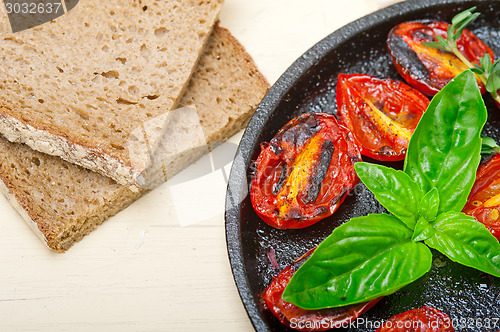 Image of baked cherry tomatoes with basil and thyme