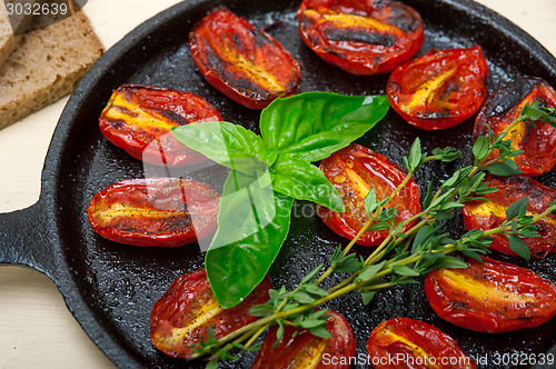 Image of baked cherry tomatoes with basil and thyme