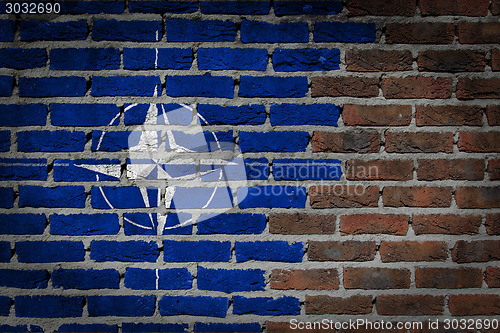 Image of Brick wall texture with flag