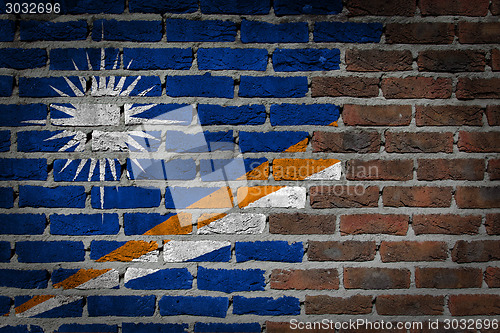 Image of Brick wall texture with flag