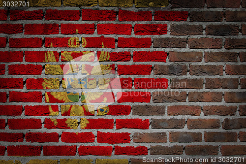 Image of Brick wall texture with flag