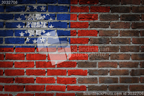 Image of Brick wall texture with flag