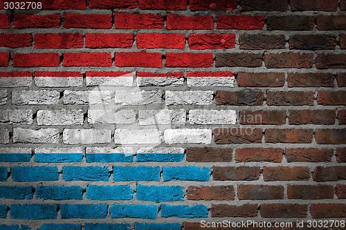 Image of Brick wall texture with flag