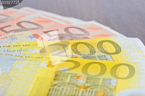 Image of Close-up of 200 and 50 Euro banknotes on the table
