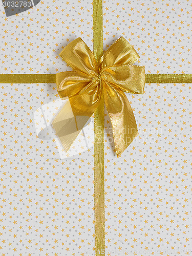 Image of  gift bow with golden satin ribbon