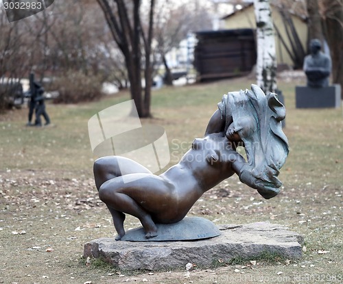 Image of Statue of a girl standing in the park