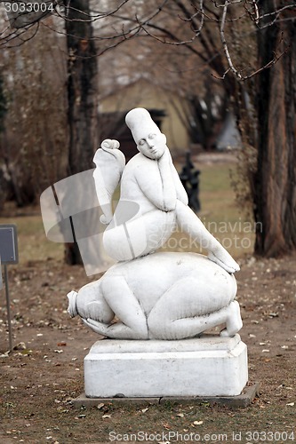 Image of Statue of a girl standing in the park