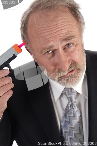 Image of Businessman dart gun