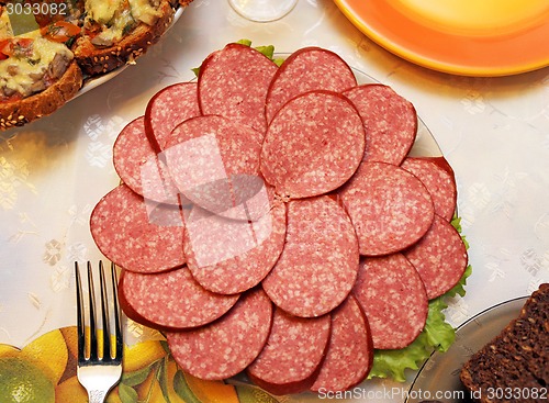 Image of Cutting sausage
