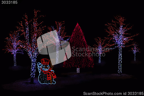Image of Illuminated Snowman and  trees 