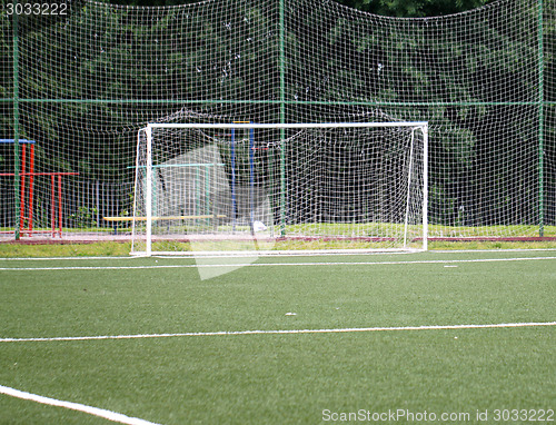 Image of Football goal on a green field on a background