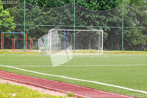 Image of Football goal on a green field on a background