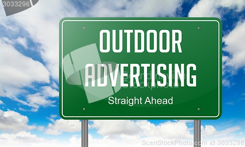 Image of Outdoor Advertising on Highway Signpost.