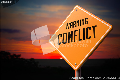 Image of Conflict on Warning Road Sign.