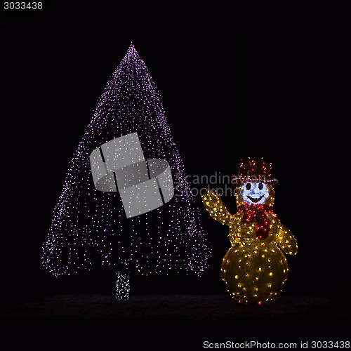 Image of Illuminated Christmas tree and Snowman 
