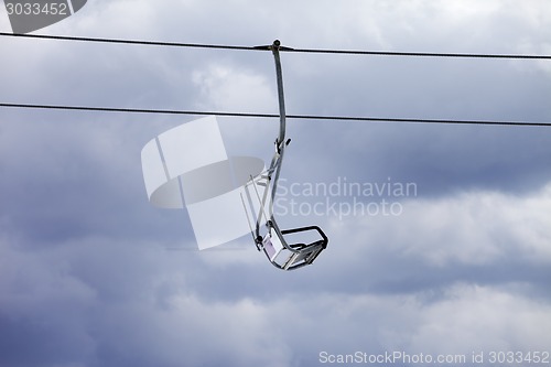 Image of Chair-lift and overcast gray sky