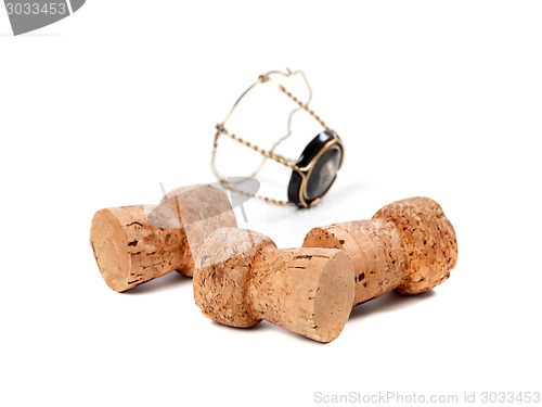 Image of Three corks from champagne wine and muselet isolated on white ba