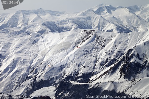 Image of Paragliders of snowy mountains