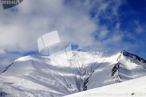 Image of View on off-piste snowy slope in wind day