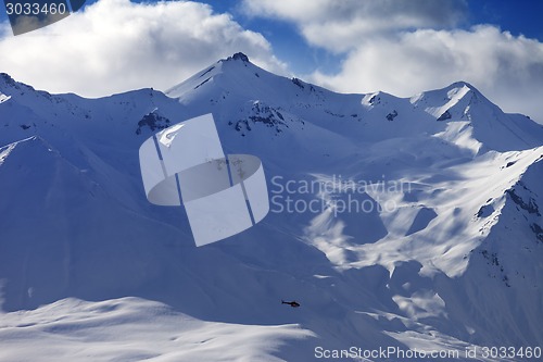 Image of Off piste slope for heliskiing and helicopter