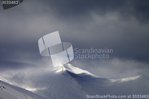 Image of View on off-piste slope in storm clouds