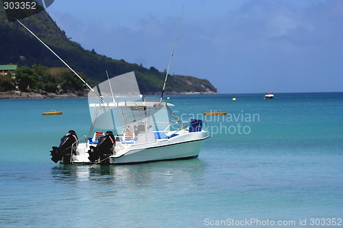 Image of waiting boat on blue lagoon