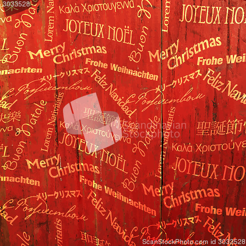 Image of Christmas Words Pattern On Red Wooden Texture. Vector