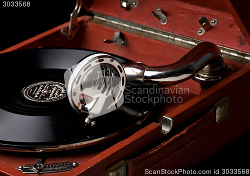 Image of gramophone with old vinyl record